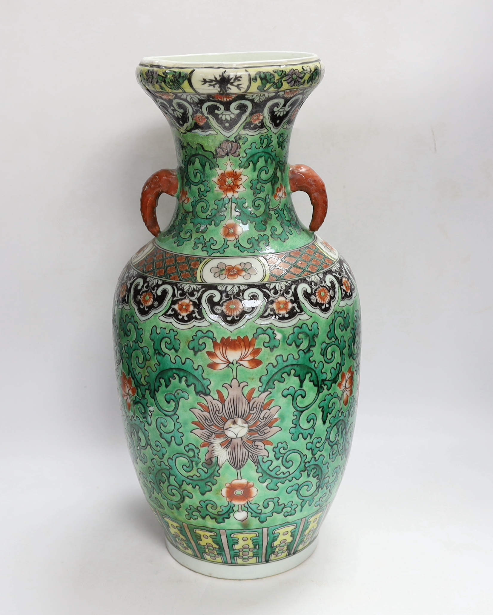 A Chinese green ground enamelled porcelain vase, Kangxi mark but late 19th century, 45cm